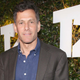 A photo of Take-Two CEO Strauss Zelnick wearing a suit and smiling.